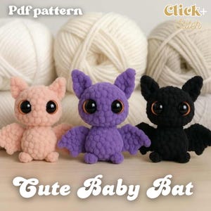 May include: Three crocheted baby bats in pink, purple, and black, with large eyes and wings. They are in front of white yarn balls. The image includes the text "Cute Baby Bat" at the bottom and "Pdf pattern" at the top.