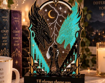 May include: A decorative acrylic display featuring a black and teal dragon design, a central silhouette of two figures, a lightning bolt, and a crescent moon. The black base is inscribed with the text, "I'll always choose you."
