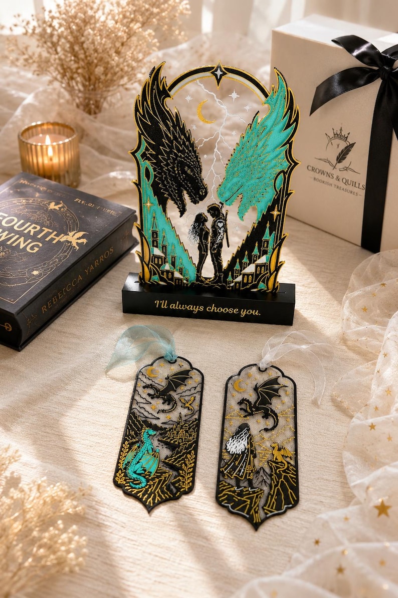May include: A decorative acrylic display featuring two dragon heads, one black and one teal, flanking a couple, with the text "I'll always choose you." on the base. Two matching bookmarks with dragon and character illustrations are placed in front.