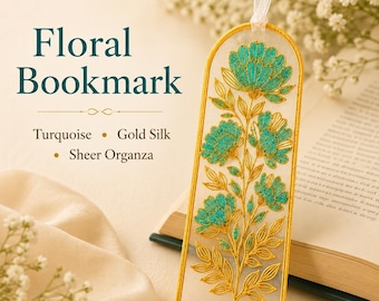 May include: A sheer organza bookmark with an arched top and gold silk border. The bookmark features embroidered turquoise flowers and gold stems with leaves. Text on the image reads: Floral Bookmark, Turquoise, Gold Silk, Sheer Organza.