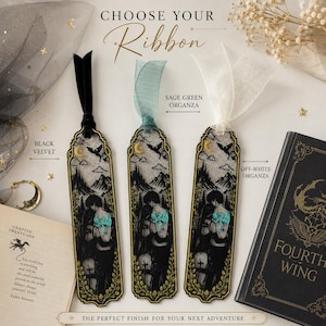 May include: Three rectangular bookmarks featuring a black lace overlay with a gold-toned mountain and dragon illustration. Each bookmark has a different ribbon: black velvet, sage green organza, and off-white organza. Text includes CHOOSE YOUR RIBBON.