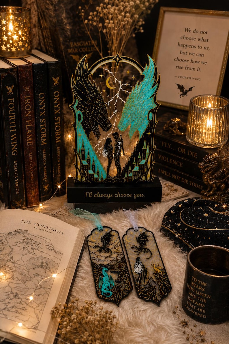 Fourth Wing gift set with blue and black dragon book stand and two matching fantasy bookmarks styled with books and warm bookish decor.
