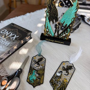 Fourth Wing inspired fantasy bookmark and dragon book stand gift set featuring turquoise gold black and white 3D printed details.