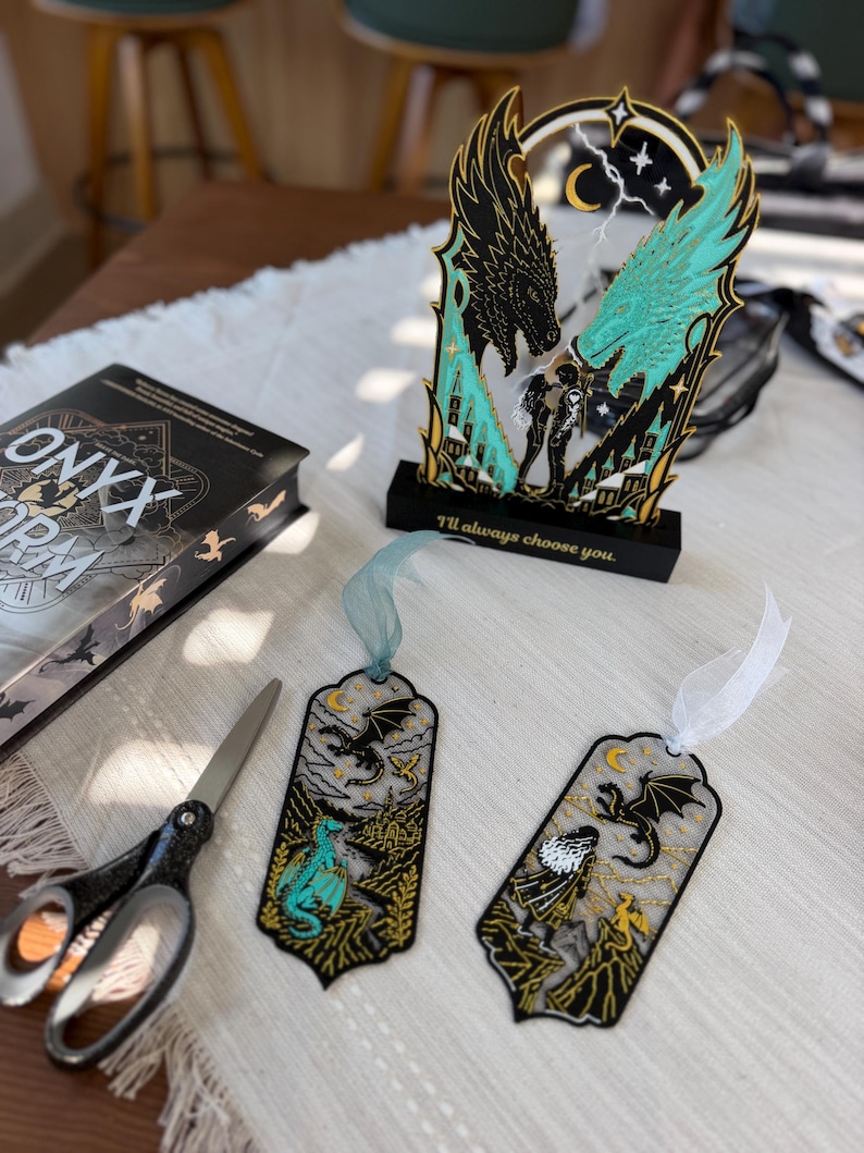 Fourth Wing inspired fantasy bookmark and dragon book stand gift set featuring turquoise gold black and white 3D printed details.