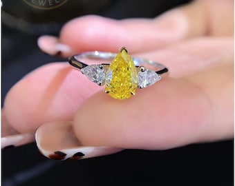 Pear Cut Fancy Yellow Lab Grown Diamond Three Stone Engagement Ring in Gold