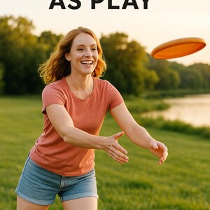 May include: A woman in a coral t-shirt and denim shorts smiles while reaching for an orange flying disc. The text "MOVEMENT AS PLAY" is at the top of the image. The scene is set in a grassy field near a lake.