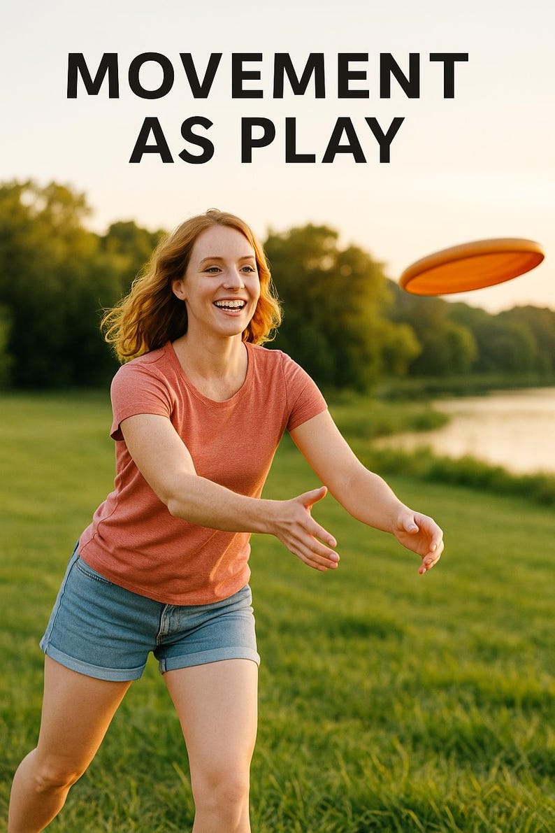 May include: A woman in a coral t-shirt and denim shorts smiles while reaching for an orange flying disc. The text "MOVEMENT AS PLAY" is at the top of the image. The scene is set in a grassy field near a lake.