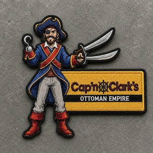 May include: An embroidered patch featuring a pirate with an eyepatch, a hook hand, and two swords. The pirate wears a blue coat, red sash, and red boots. Next to the pirate is a yellow rectangular sign with the text Cap'n Clark's and OTTOMAN EMPIRE.