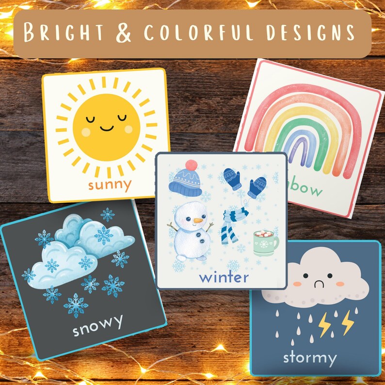 May include: A collection of square cards with weather-themed illustrations. The cards feature a smiling sun, a rainbow, a snowman, a cloud with snowflakes, and a cloud with rain and lightning. Each card has a weather-related word.