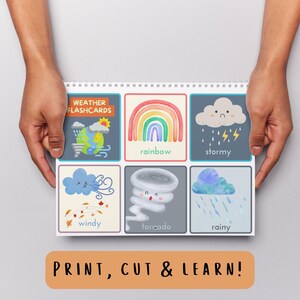 May include: A spiral-bound set of weather flashcards featuring colorful illustrations of weather conditions. The cards include images of a rainbow, stormy clouds, and a tornado. The text "PRINT, CUT & LEARN!" is displayed at the bottom.
