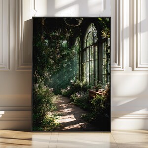 Printable wall art featuring a mystical greenhouse interior with deep green tones and vintage floral elements, perfect for a dark cottagecore or botanical witch aesthetic in any cozy living space. Ideal for instant download and home decor.