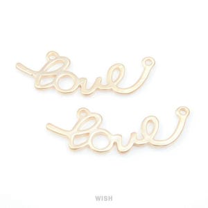 May include: Two gold-coloured metal charms spelling the word "love" in a cursive font. Each charm has a small loop at each end for attaching to jewellery or other crafts. The word "WISH" is printed at the bottom.