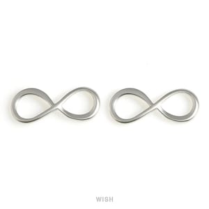May include: Two silver-coloured infinity symbol charms. The charms are in the shape of the mathematical infinity symbol, with a smooth, polished finish. The word "WISH" is printed in the bottom centre of the image.