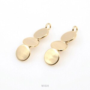 May include: Two gold-colored pendant charms, each with three connected oval discs. The charms have a small loop at the top for attaching to jewelry. The pendants are displayed on a white background.