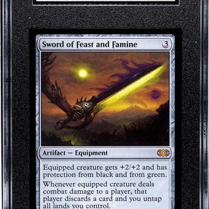 May include: A graded Magic: The Gathering card, "Sword of Feast and Famine," from the Double Masters set. The card features a fantasy illustration of a glowing sword. The card is graded 9 MT by SGC, with a certification number.