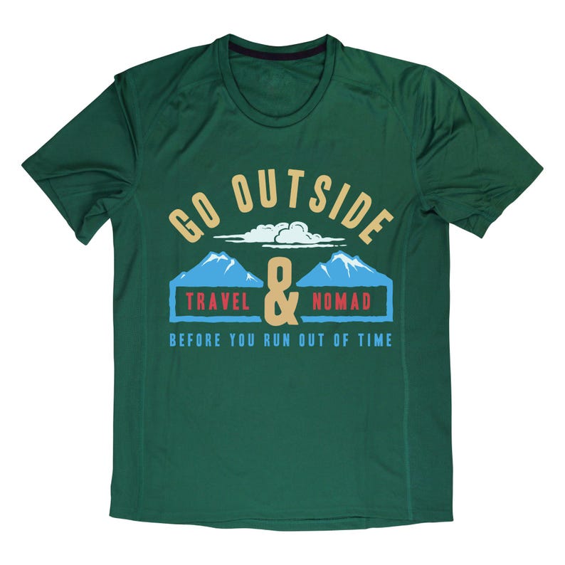 May include: A dark green t-shirt with a graphic that reads "GO OUTSIDE & TRAVEL NOMAD BEFORE YOU RUN OUT OF TIME." The design includes mountains, clouds, and the ampersand symbol.