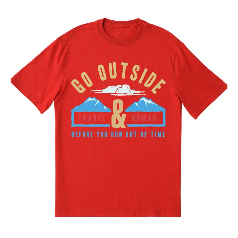 May include: A red t-shirt with the words "GO OUTSIDE" in a gold color, above a graphic of two blue mountains and the words "TRAVEL & NOMAD" in a blue rectangle. The text "BEFORE YOU RUN OUT OF TIME" is below.