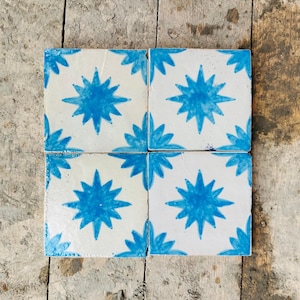 May include: A set of three ceramic mugs with a speckled, matte finish. The mugs are in shades of cream, light gray, and dark gray. Each mug has a simple, minimalist design, perfect for coffee or tea.