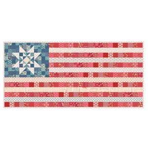 May include: A patriotic quilt featuring the American flag design. The quilt showcases a blue square with a star pattern in the upper left corner, and red and white stripes. The stripes are made of various patterned fabrics.