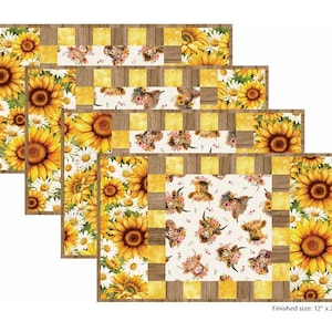 May include: Five rectangular placemats with a sunflower and daisy design. The placemats have a finished size of 12 x 20 inches. The center of each placemat features a pattern of Highland cows wearing floral crowns.