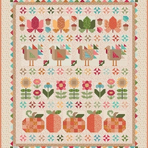 May include: A rectangular quilt featuring a cream-colored background with a repeating floral pattern. The design includes rows of appliqued autumn motifs: maple leaves, acorns, turkeys, sunflowers, flowers, and pumpkins in orange, red, and green.