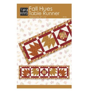 May include: A fall-themed table runner with a leaf pattern. The runner is 20 inches by 76 inches. The design features brown, orange, and white colors. The text "Fall Hues Table Runner" is visible.