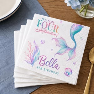 May include: A stack of white paper napkins featuring a colorful mermaid tail, coral, and a seashell with a pearl. The text reads: IT'S TIME FOUR a shellabration! Bella 4TH BIRTHDAY. The design includes pastel bubbles in shades of blue, pink, and purple.