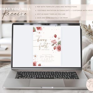 May include: A laptop displays a digital invitation with the text "Emma's berry first birthday." The invitation features watercolor illustrations of strawberries and flowers. The laptop screen also shows text: "What you will receive" and bullet points about the product.