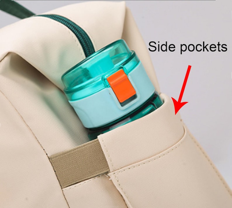 May include: A close-up of a beige backpack with a teal zip and a side pocket holding a teal and orange water bottle. The text "Side pockets" is visible.