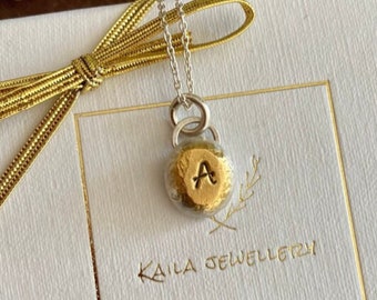 24k gold plated solid sterling silver initial, organic hand stamped pebble charm necklace. Personalised letter necklace.