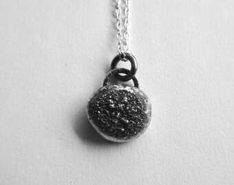 Handmade small rustic dust sterling silver pebble necklace pendant, oxidised silver.