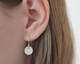 Hammered sterling silver disc earrings.