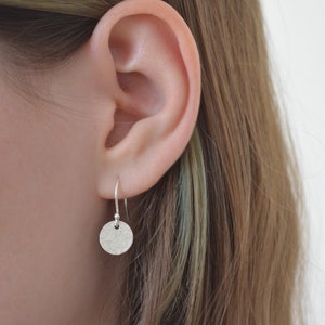 Hammered sterling silver disc earrings.