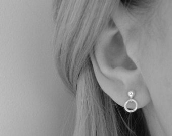 Small minimalist sterling silver ball and circle stud earrings.