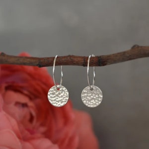 Sterling silver disc charm hoop earrings. Hammered disc earrings.