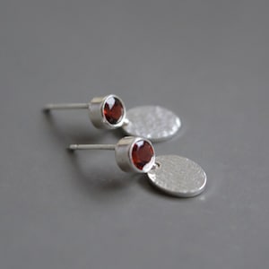 Small minimalist sterling silver stud earrings with garnet.