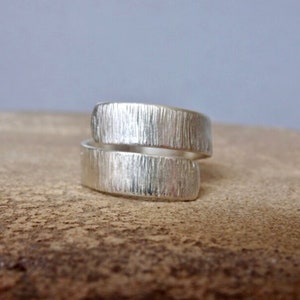 Handmade sterling silver adjustable wrap textured ring.