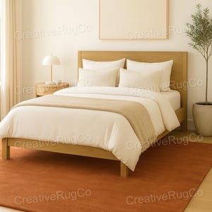 Rust terracotta area rug in neutral modern bedroom interior