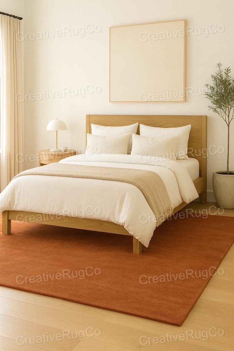 Rust terracotta area rug in neutral modern bedroom interior