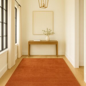 Scandinavian bedroom with warm earthy tone rug