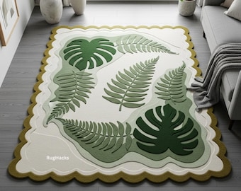 Puede incluir: Alfombra decorativa con un diseño botánico de hojas verdes de helechos y monstera. La alfombra tiene un borde festoneado con un borde verde claro y el texto "RugHacks".