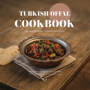 May include: A cookbook cover with the title "TURKISH OFFAL COOKBOOK" in large white letters. The image features a bowl of cooked food with red and green ingredients, and two pieces of flatbread on a wooden surface.