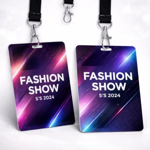 May include: Two rectangular identification badges attached to black lanyards with silver metal swivel hooks. The badges feature a dark background with diagonal streaks of pink and blue light, displaying the white text FASHION SHOW S'S 2024.