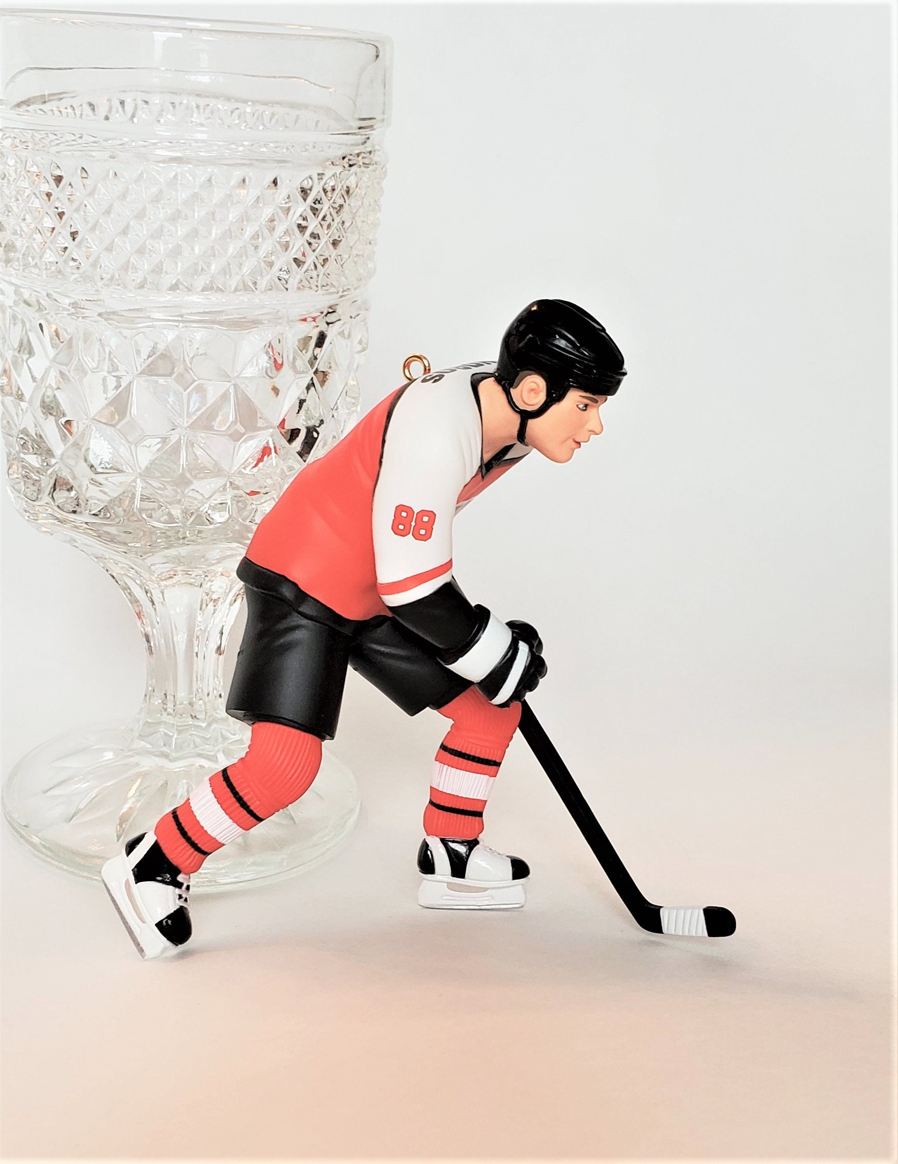 Ice Hockey Puck and Sticks. Sport Symbol Graphic by DG-Studio