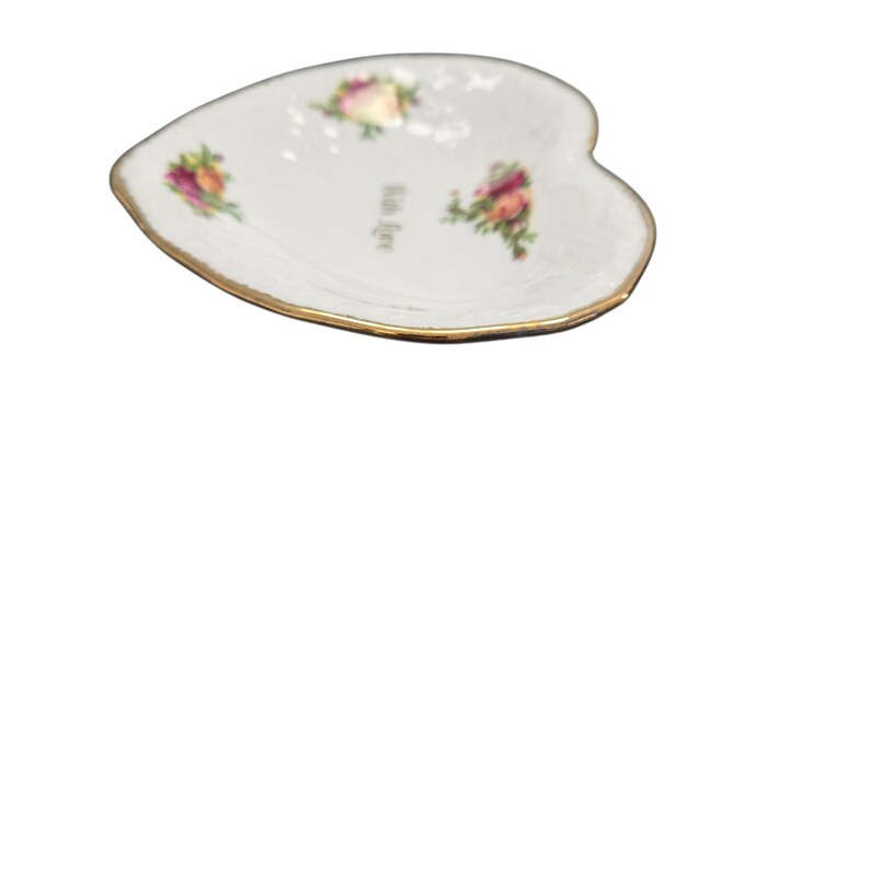 May include: Heart-shaped white dish with a gold rim, featuring floral designs and the text "With Love". The dish has a delicate appearance, suitable for serving small items or as a decorative piece.
