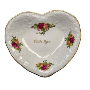 May include: A rustic wooden sign with the text "Welcome to our home" in white lettering. The sign features a distressed finish and a simple, inviting design, perfect for a front porch or entryway.