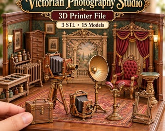 May include: A 3D printer file set titled Victorian Photography Studio featuring 15 miniature models including a bellows camera on a tripod, a portable camera, a studio light, a wooden chest, a red velvet chair, and a small mirror.
