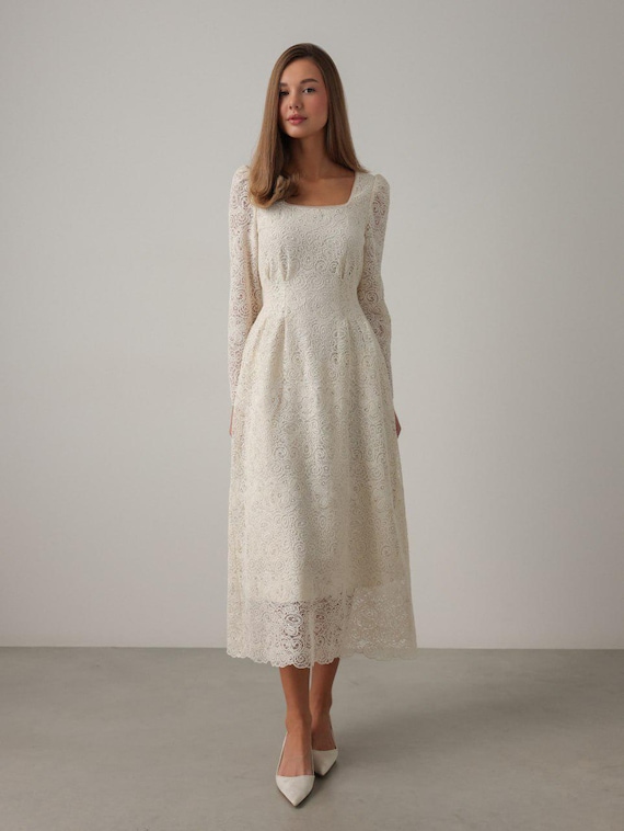 cream lace midi dress with sleeves Dress: Bridal Long Sleeve Gown YGroup_franki-midi Fit Model is 5’7 Travel OOTD- what to Wedding dress Size:13.5 US Women (10.5 AU/UK)