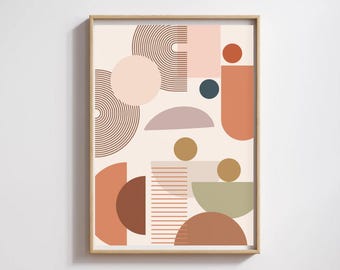 May include: Framed abstract art print. The artwork displays geometric shapes in brown, peach, pink, and green on a cream background. The shapes include circles, semi-circles, and rectangles. The design is minimalist and modern, with a wooden frame.