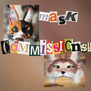 May include: Two cat masks with fur and painted details. One mask is orange, black, and white, the other is brown and white. The word "mask" and "Commissions!" are cut out from magazines and placed on a brown background.